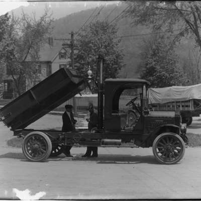 Portrait of Two Men and Indiana Dump Truck