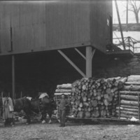 Loaded Log Sled with Four Horse Hitch.