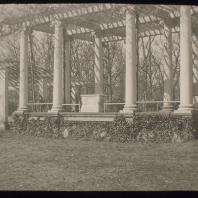 Portico with classical columns and vines