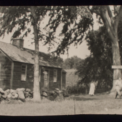 House with four people in yard